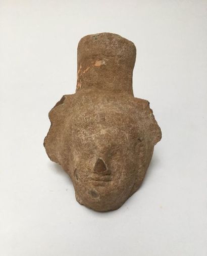 Anthropomorphic neck of a jug. Pink terracotta....