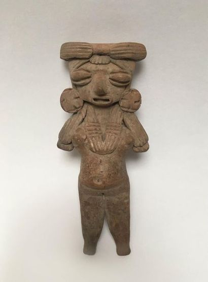 Flat brown terracotta figurine representing...