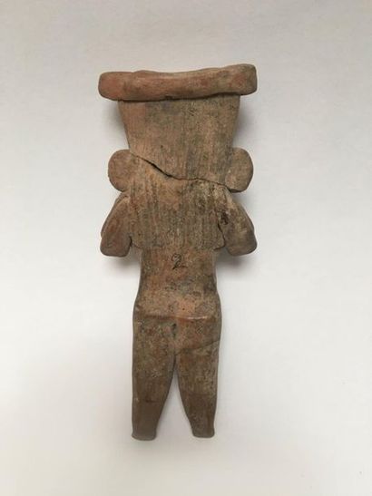 Flat brown terracotta figurine representing...