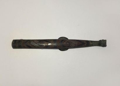 Bronze fibula inlaid with a semi of silver...