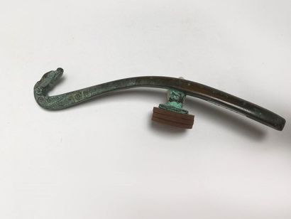 Classical curved fibula in bronze with green...