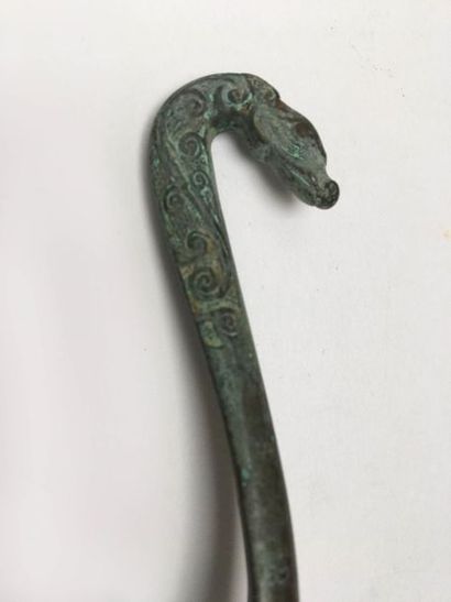 Classical curved fibula in bronze with green...