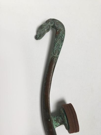 Classical curved fibula in bronze with green...