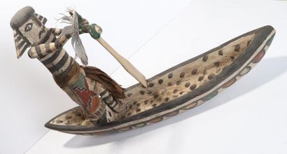 Decorative doll represented on a canoe, made...