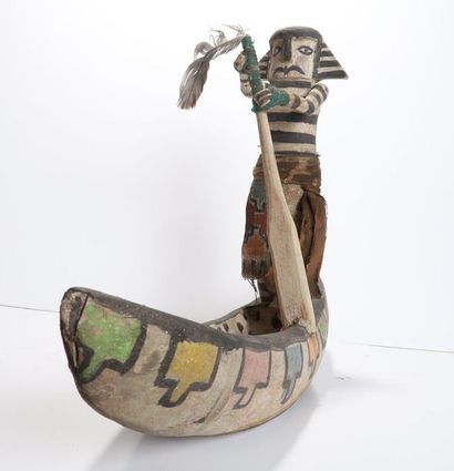 Decorative doll represented on a canoe, made...