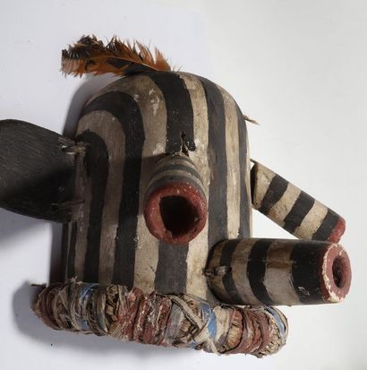 Decorative mask having a head with cylindrical...