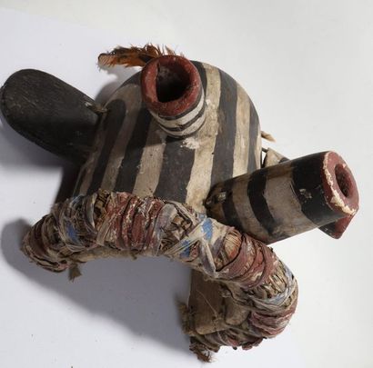 Decorative mask having a head with cylindrical...