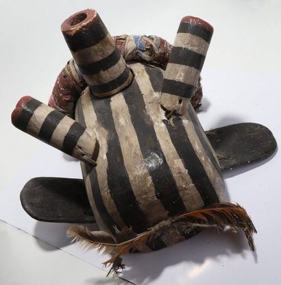 Decorative mask having a head with cylindrical...