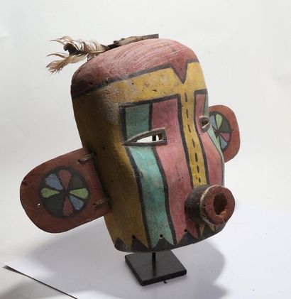 Anthropomorphic decorative mask with a cylindrical...