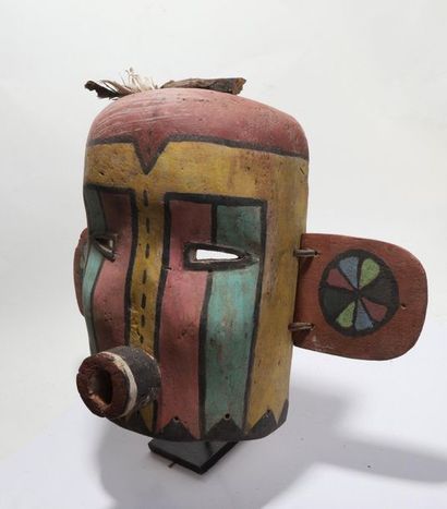Anthropomorphic decorative mask with a cylindrical...