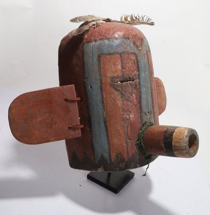 Anthropozoomorphic decorative mask with a...