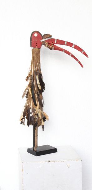 Puppet with a very long-billed bird's head.

Polychrome...