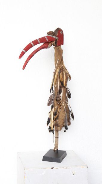 Puppet with a very long-billed bird's head.

Polychrome...