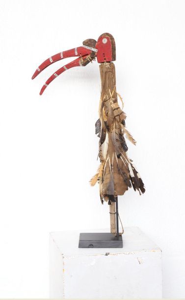 Puppet with a very long-billed bird's head.

Polychrome...
