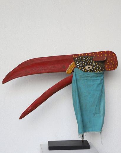 Puppet with a very long-billed bird's head.

Polychrome...