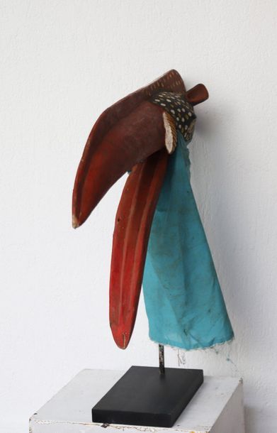 Puppet with a very long-billed bird's head.

Polychrome...