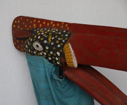 Puppet with a very long-billed bird's head.

Polychrome...