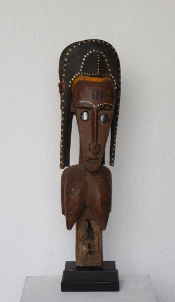 Puppet with a female bust with an elongated...
