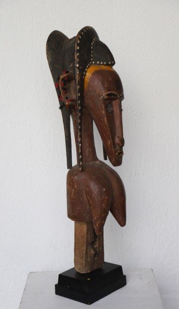 Puppet with a female bust with an elongated...