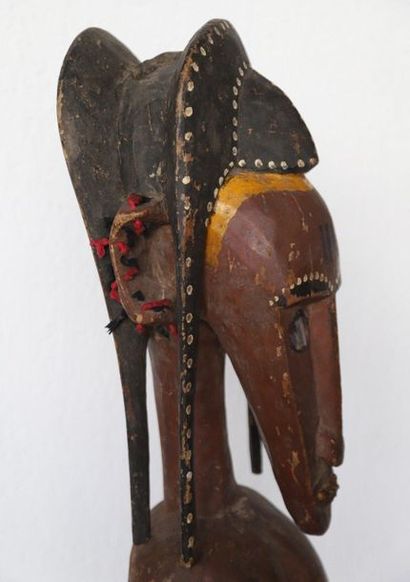 Puppet with a female bust with an elongated...