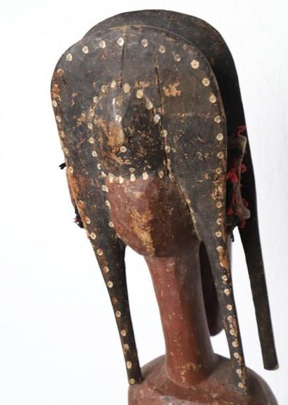 Puppet with a female bust with an elongated...