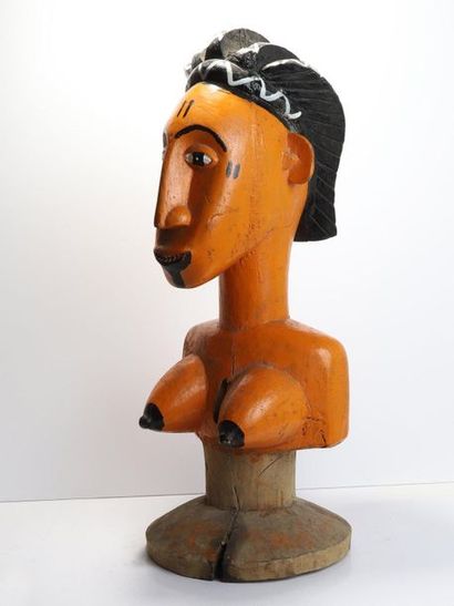 Puppet presenting a woman with an elongated...