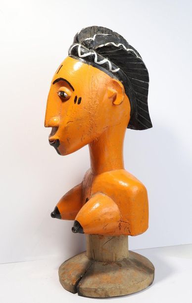 Puppet presenting a woman with an elongated...