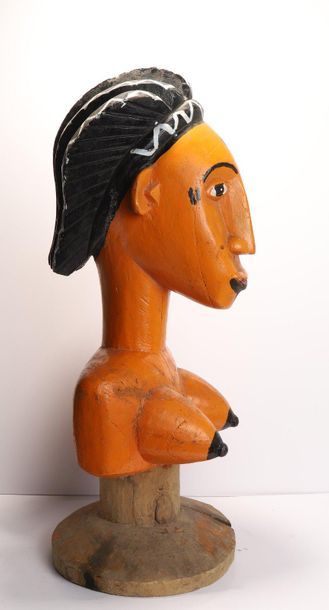 Puppet presenting a woman with an elongated...