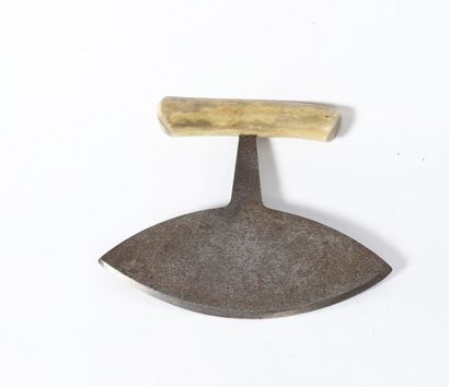 Scraper with oval blade, the handle made...