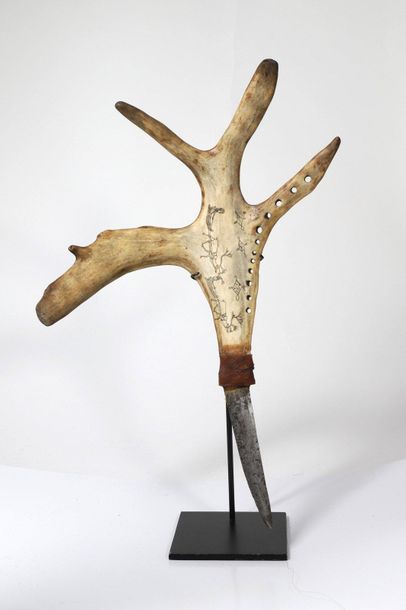 Knife with a slightly curved blade, the handle...