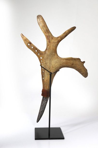 Knife with a slightly curved blade, the handle...
