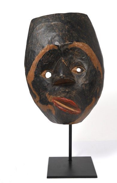 Wooden mask with a polychrome patina and...
