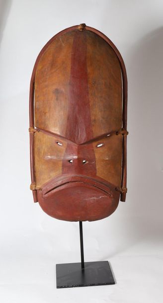 Anthropomorphic mask with an austere face....