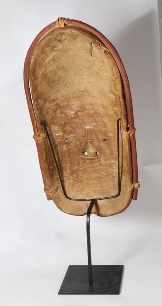 Anthropomorphic mask with an austere face....