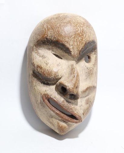 Decorative mask with a deformed face 
 
Wood,...