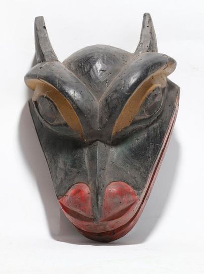 Decorative zoomorphic mask with a wolf's...