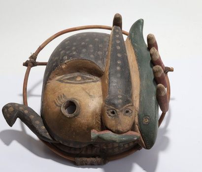 Anthropozoomorphic decorative mask with a...
