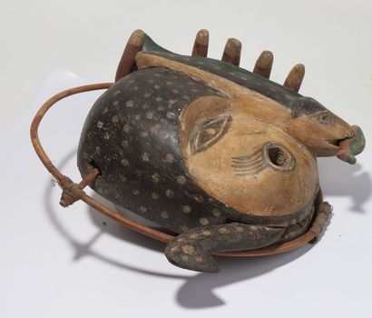 Anthropozoomorphic decorative mask with a...