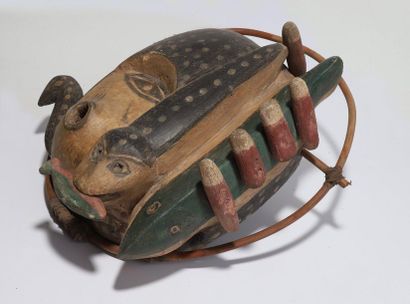 Anthropozoomorphic decorative mask with a...