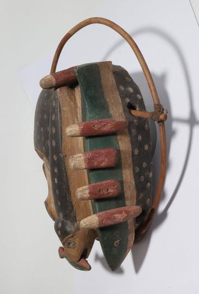 Anthropozoomorphic decorative mask with a...