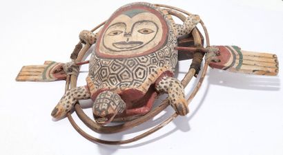 Anthropozoomorphic decorative mask with an...