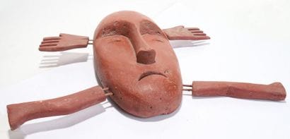Anthropomorphic decorative mask with an oval...