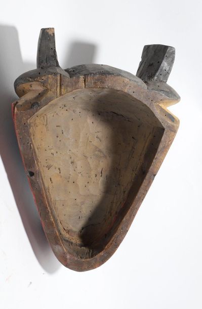 Decorative zoomorphic mask with a wolf's...