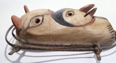 Anthropozoomorphic decorative mask with a...