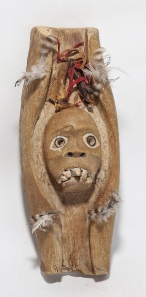 Decorative mask having a face with prominent...