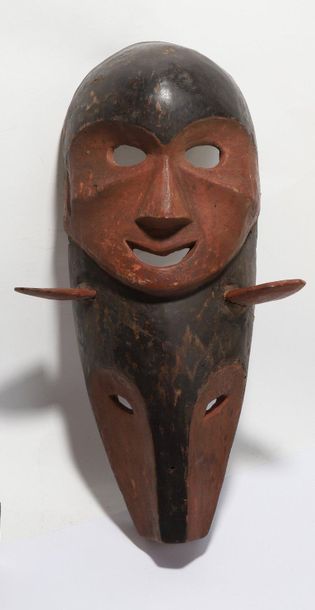 Decorative double mask with a human face...