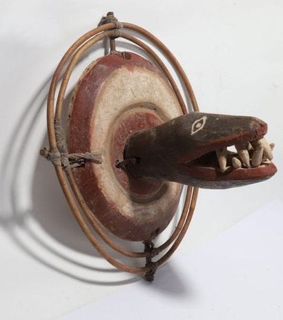 Decorative zoomorphic mask with a snake's...