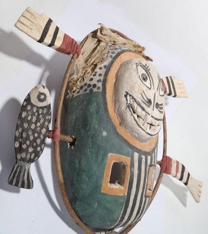 Anthropomorphic decorative mask with a round...