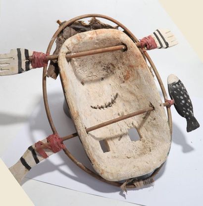 Anthropomorphic decorative mask with a round...