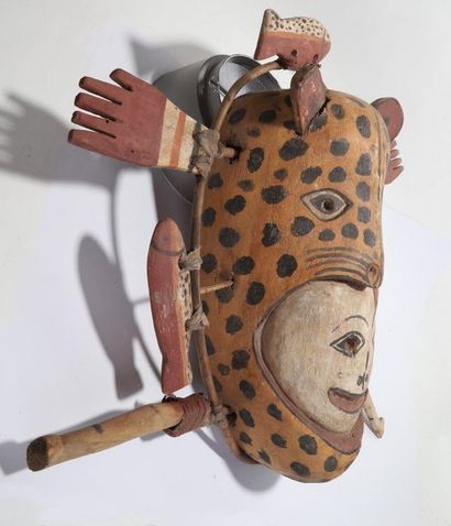 Anthropozoomorphic decorative mask with a...